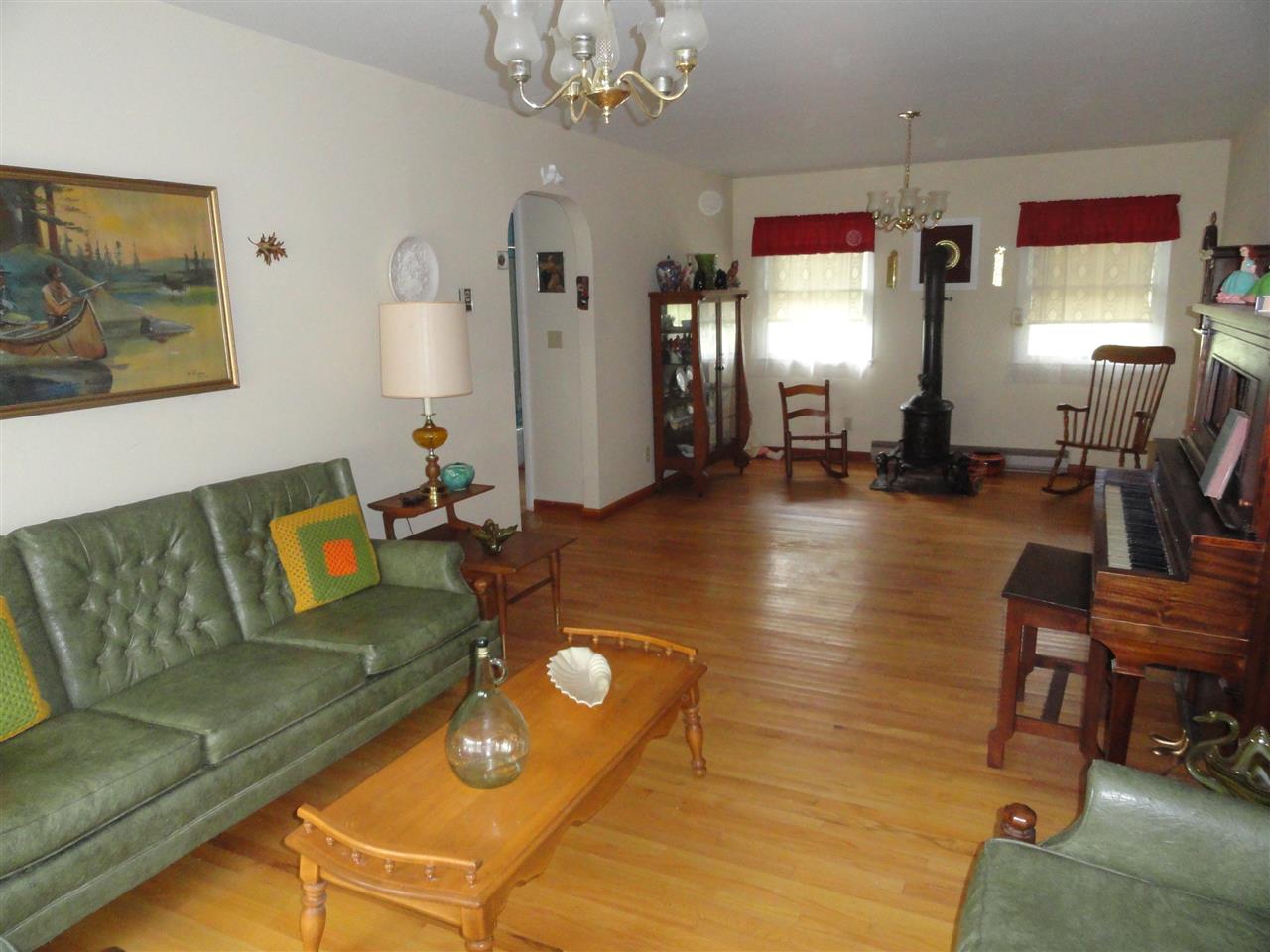 21033 Brocks Gap Road Bergton, VA 22811 - Photo 3 of 9 a living room with furniture fireplace and a chandelier