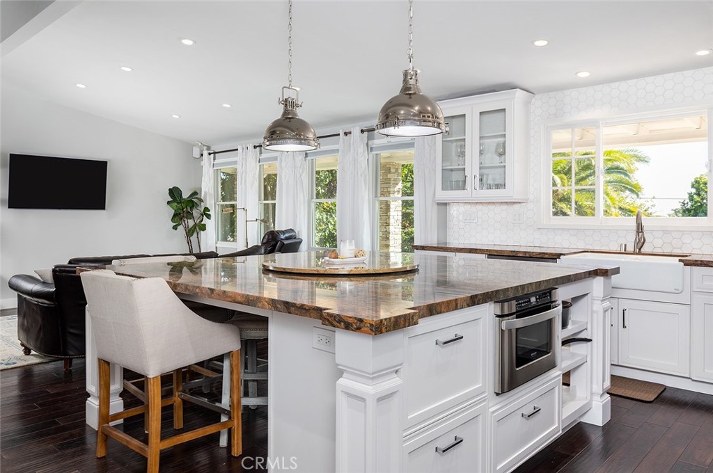 2212 Rim Road Duarte, CA 91008 - Photo 14 of 52 a kitchen with stainless steel appliances granite countertop a stove and a sink