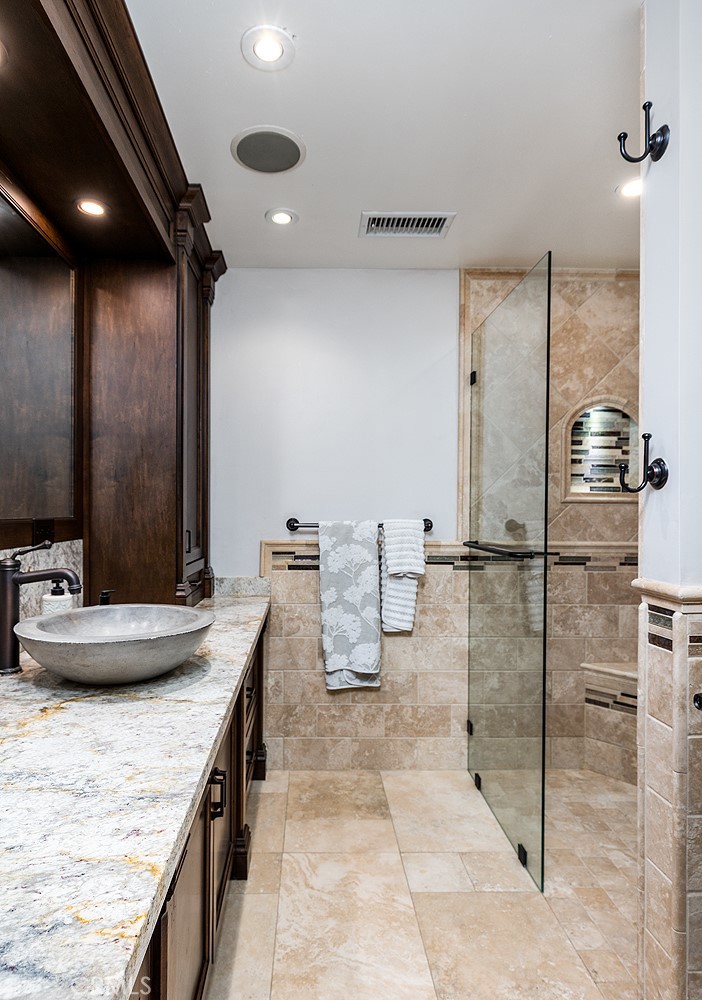 2212 Rim Road Duarte, CA 91008 - Photo 23 of 52 a bathroom with a granite countertop sink a toilet and a mirror