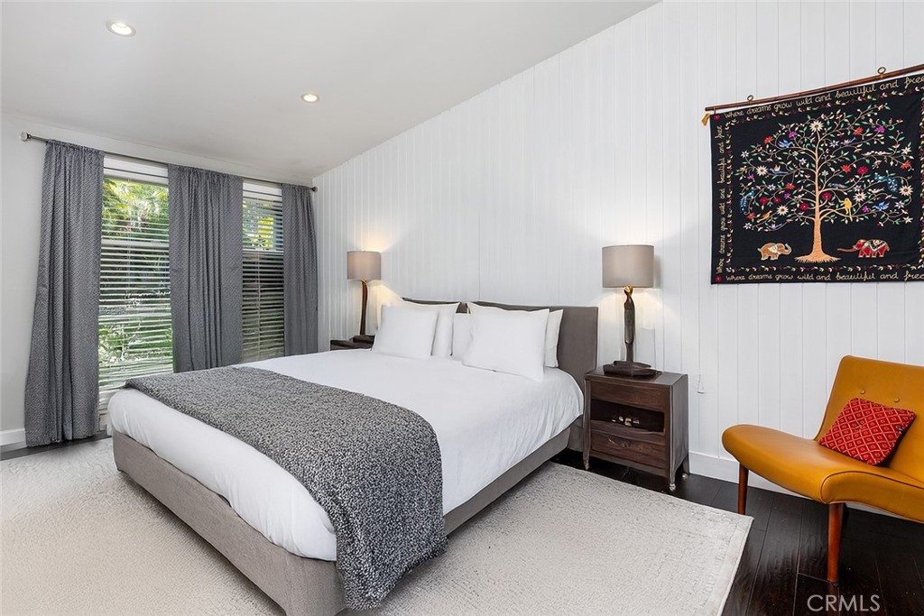 2212 Rim Road Duarte, CA 91008 - Photo 24 of 52 a spacious bedroom with a bed and chair