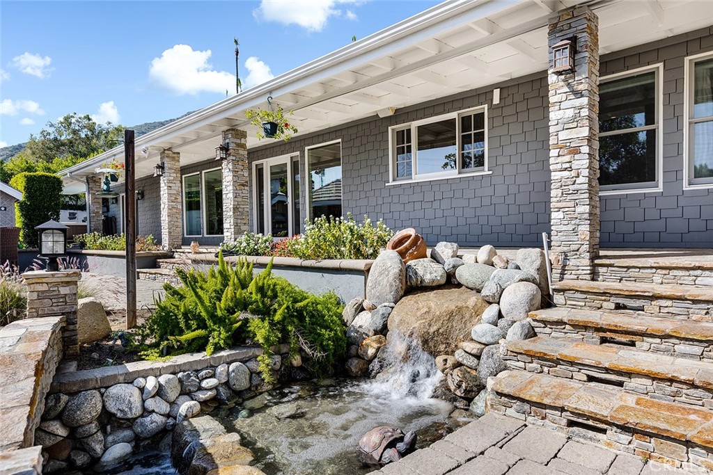 2212 Rim Road Duarte, CA 91008 - Photo 31 of 52 a view of a patio with couches table and chairs and potted plants