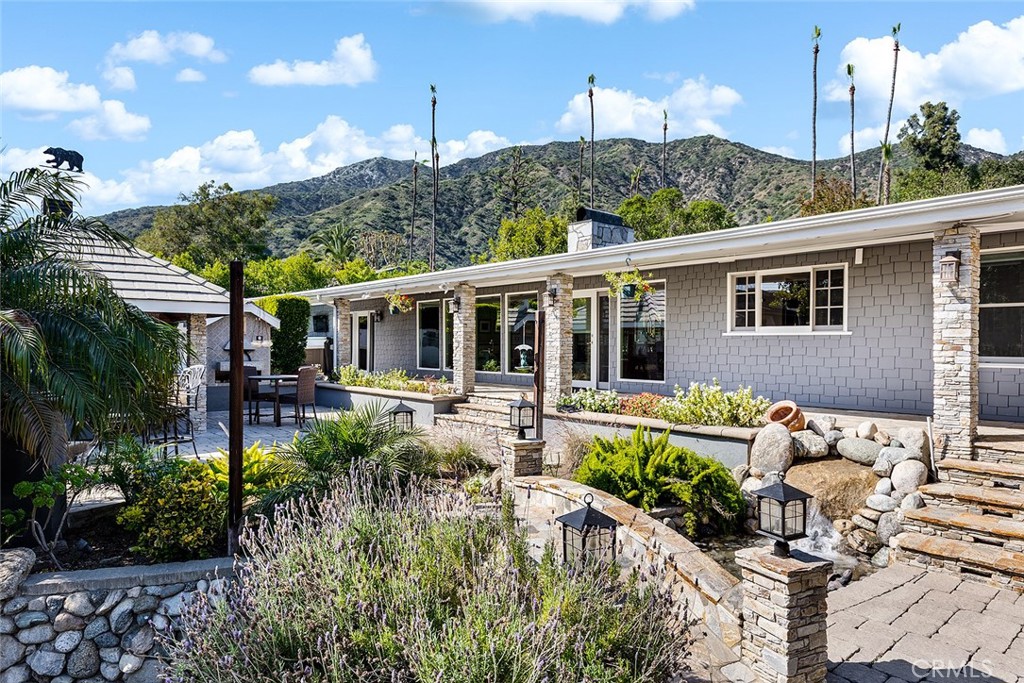 2212 Rim Road Duarte, CA 91008 - Photo 32 of 52 a house view with a sitting space and garden