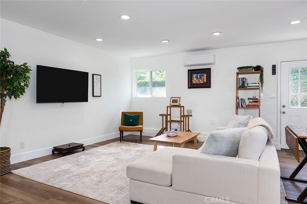 2212 Rim Road Duarte, CA 91008 - Photo 48 of 52 a living room with furniture and a flat screen tv