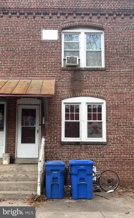 a front view of a house with parking space