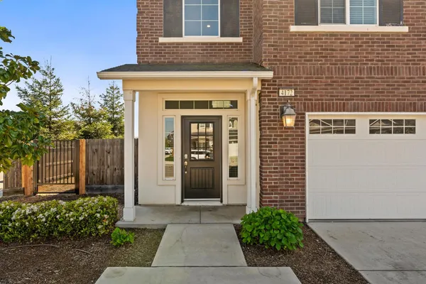 front view of a house with a yard