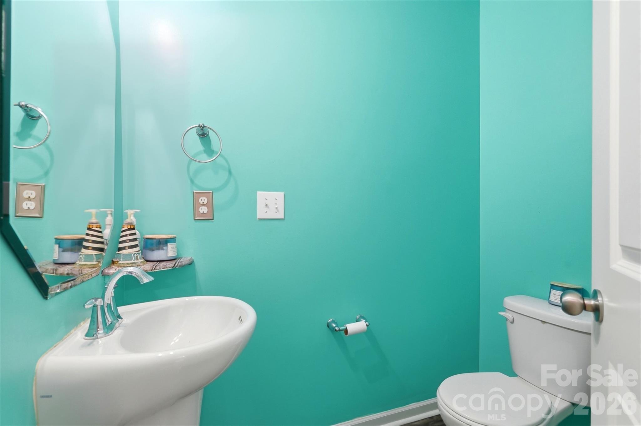 7017 Whitewater Loop Lowell, NC 28098 - Photo 13 of 39 a bathroom with a sink and a mirror