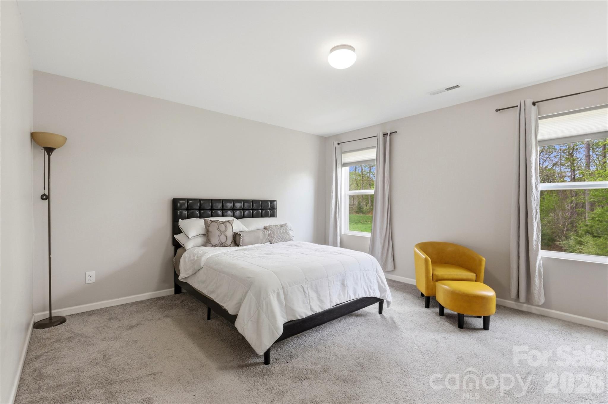 7017 Whitewater Loop Lowell, NC 28098 - Photo 14 of 39 a bedroom with a bed and a window