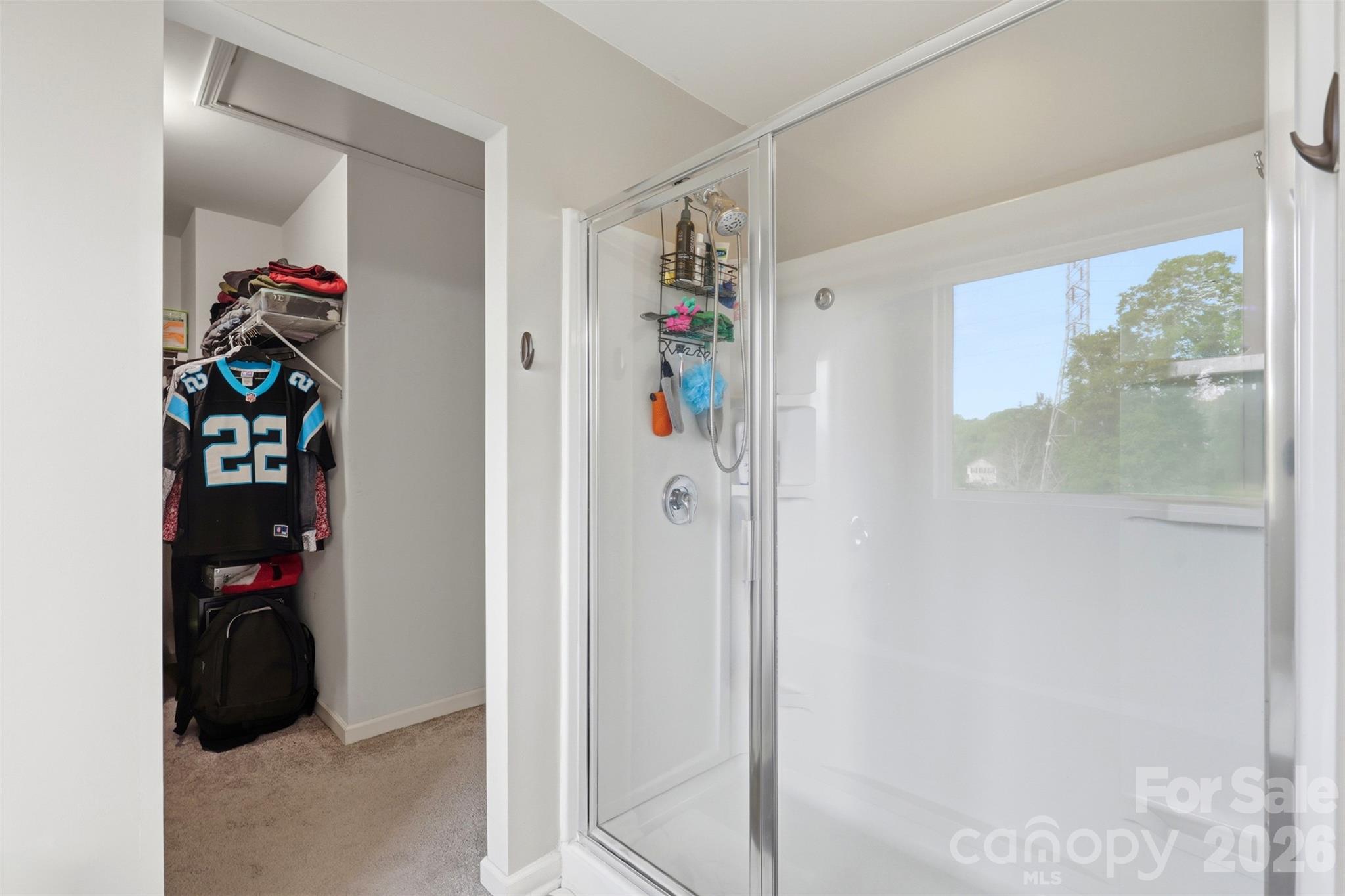 7017 Whitewater Loop Lowell, NC 28098 - Photo 20 of 39 a view of walk in closet with clothes and shoes