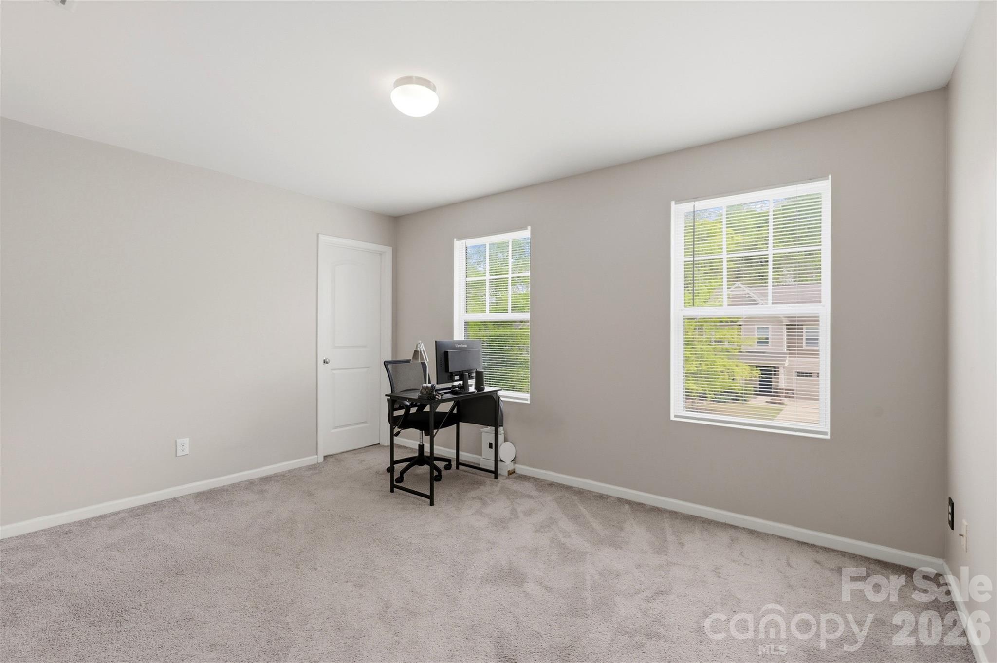 7017 Whitewater Loop Lowell, NC 28098 - Photo 21 of 39 a view of wooden floor and windows in a room