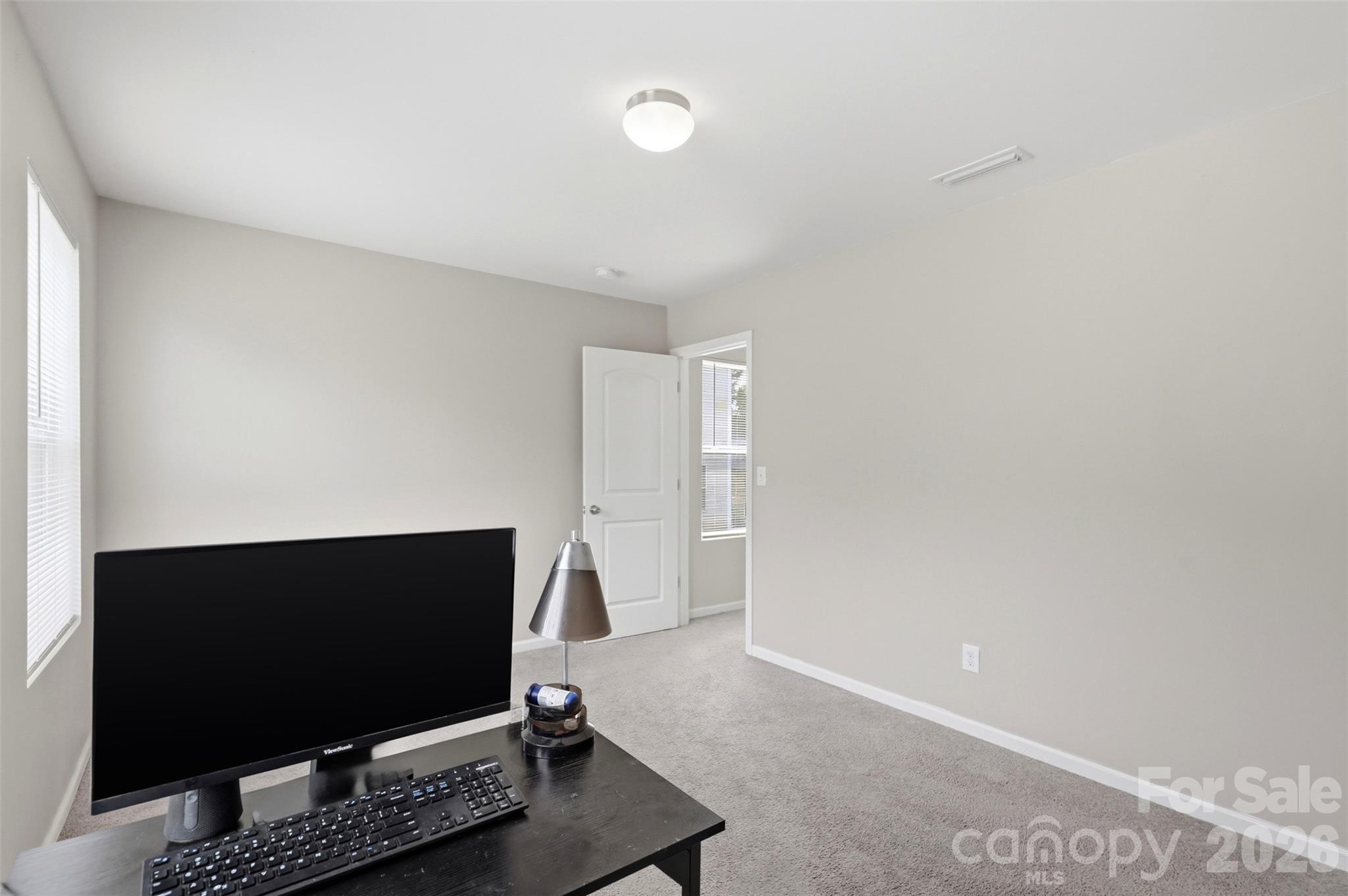 7017 Whitewater Loop Lowell, NC 28098 - Photo 23 of 39 a living room with window and a flat screen tv