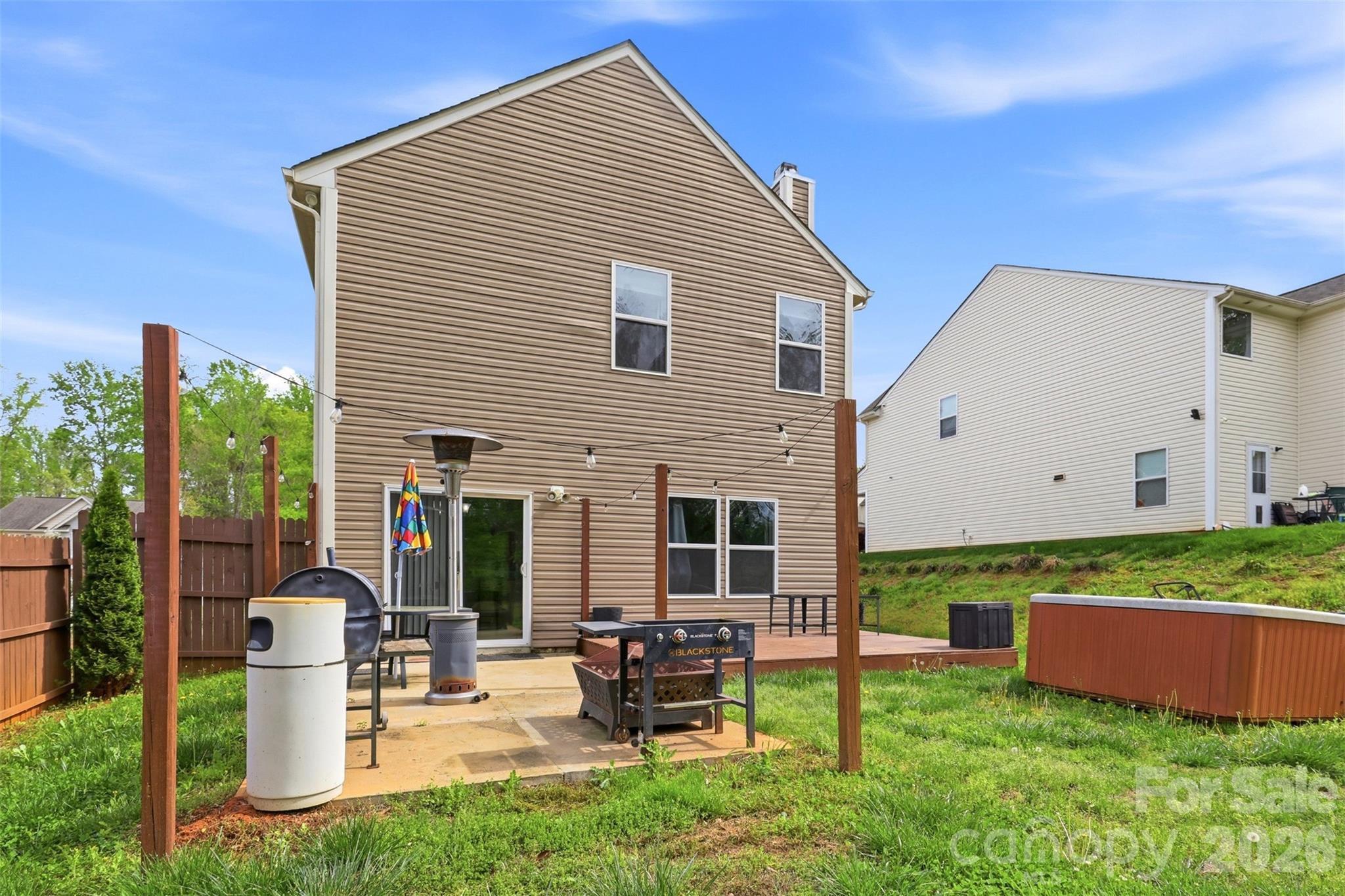 7017 Whitewater Loop Lowell, NC 28098 - Photo 29 of 39 a front view of a house with garden and sitting area