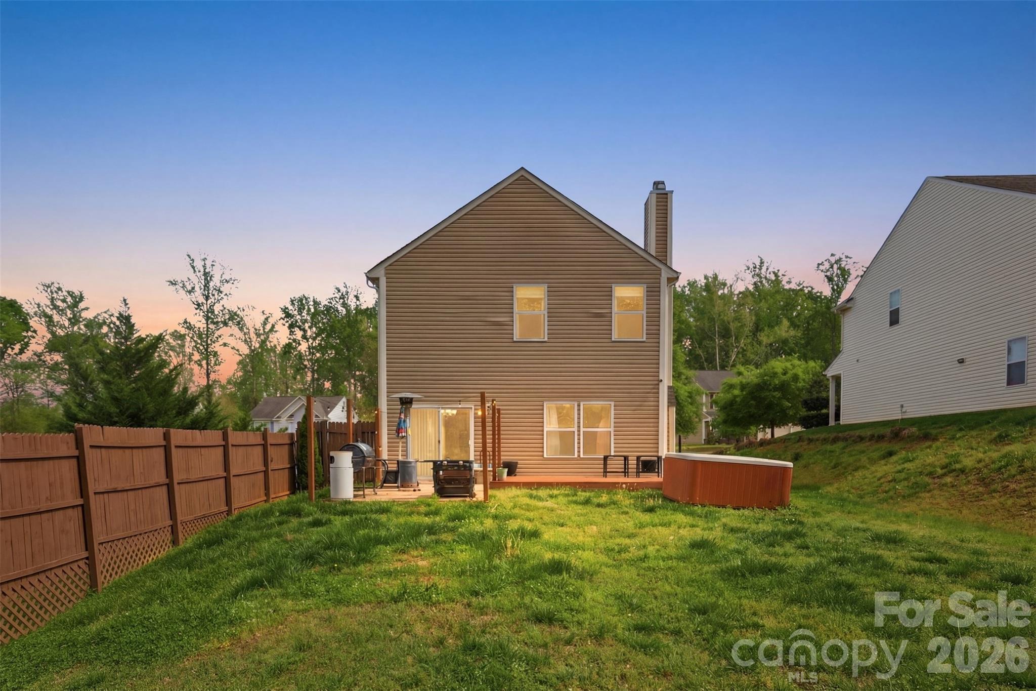 7017 Whitewater Loop Lowell, NC 28098 - Photo 30 of 39 a view of backyard of house with wooden fence