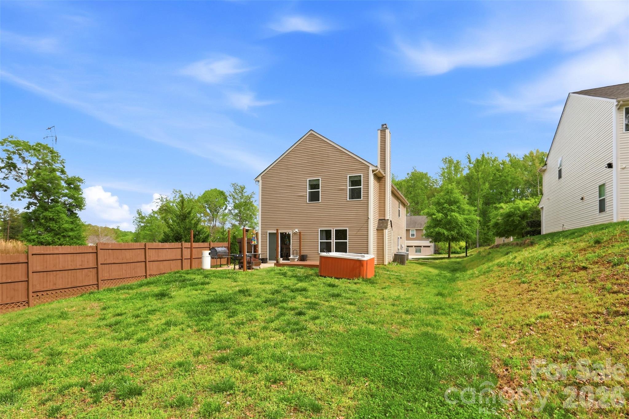 7017 Whitewater Loop Lowell, NC 28098 - Photo 32 of 39 a view of a house with a yard and sitting area