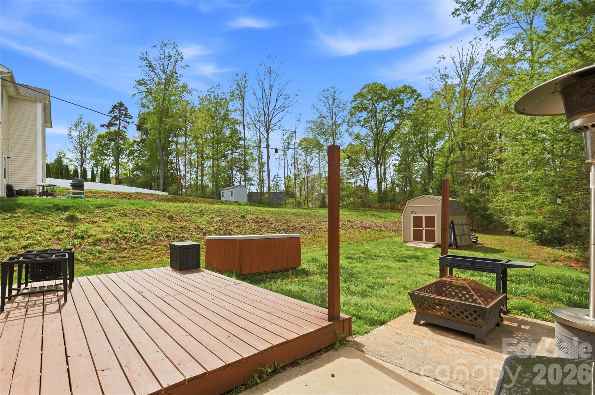 7017 Whitewater Loop Lowell, NC 28098 - Photo 33 of 39 a view of a backyard with sitting area