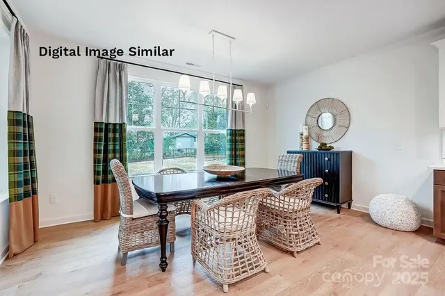 a bedroom with furniture and a large window