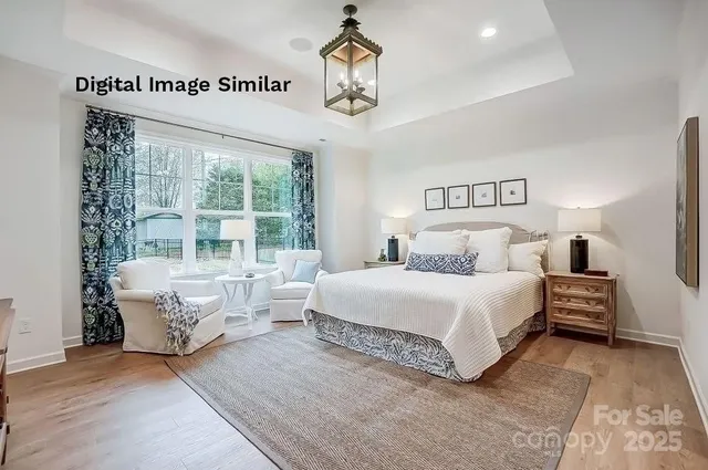 a spacious bedroom with a bed and a large window