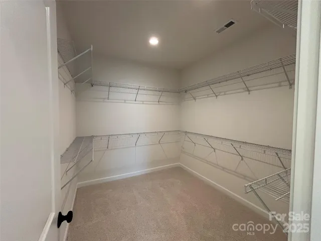 a view of a room with racks on the wall