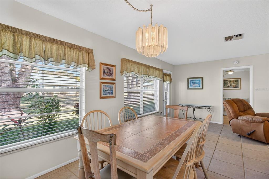 4841 Boonesboro Court New Port Richey, FL 34655 - Photo 12 of 44 a dining room with furniture and window
