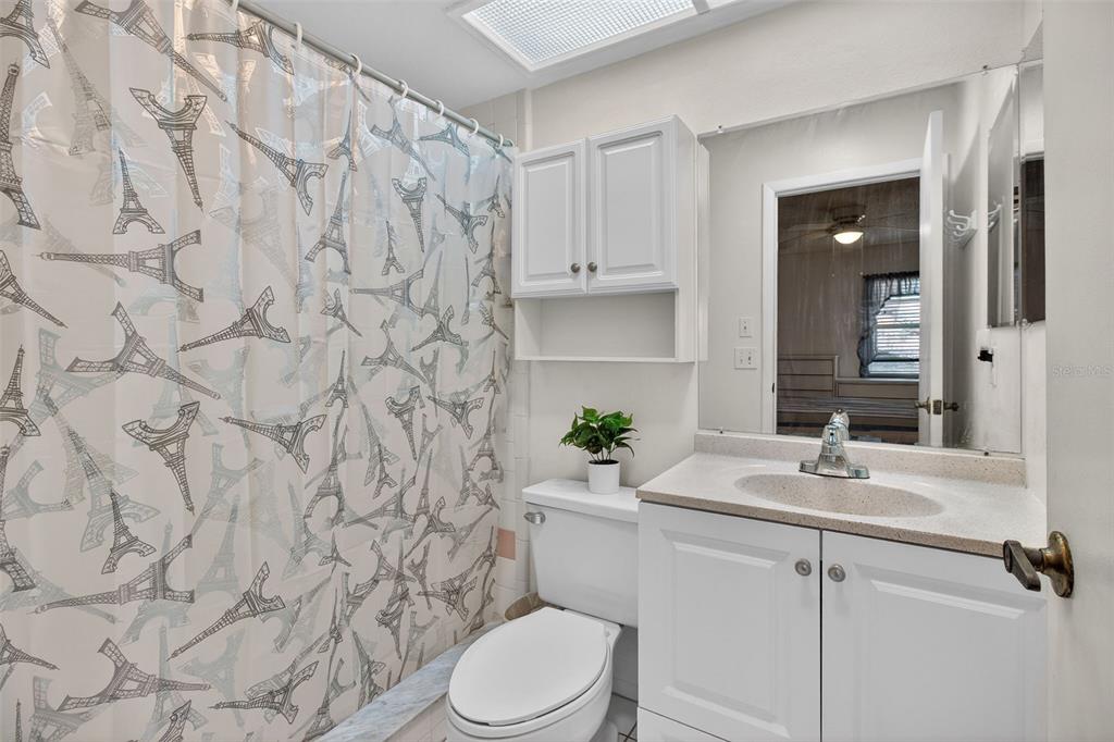 4841 Boonesboro Court New Port Richey, FL 34655 - Photo 19 of 44 a bathroom with a sink toilet and shower