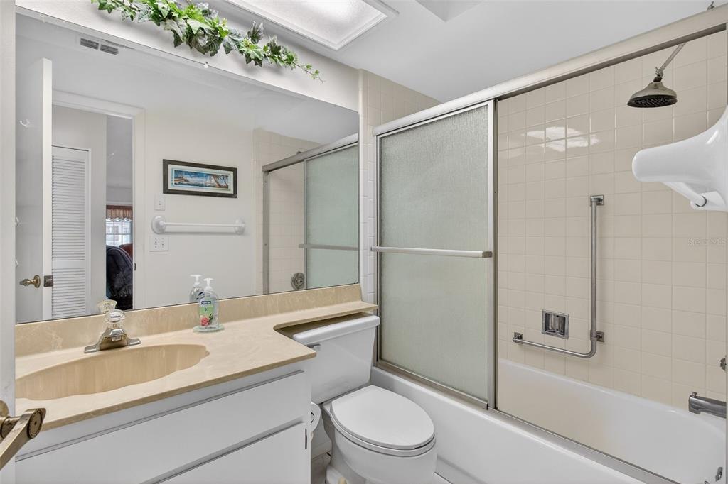 4841 Boonesboro Court New Port Richey, FL 34655 - Photo 22 of 44 a bathroom with a sink a toilet and shower