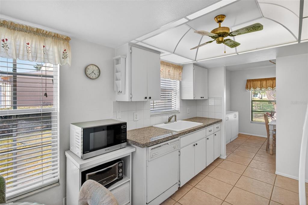4841 Boonesboro Court New Port Richey, FL 34655 - Photo 8 of 44 a kitchen with a sink appliances and cabinets