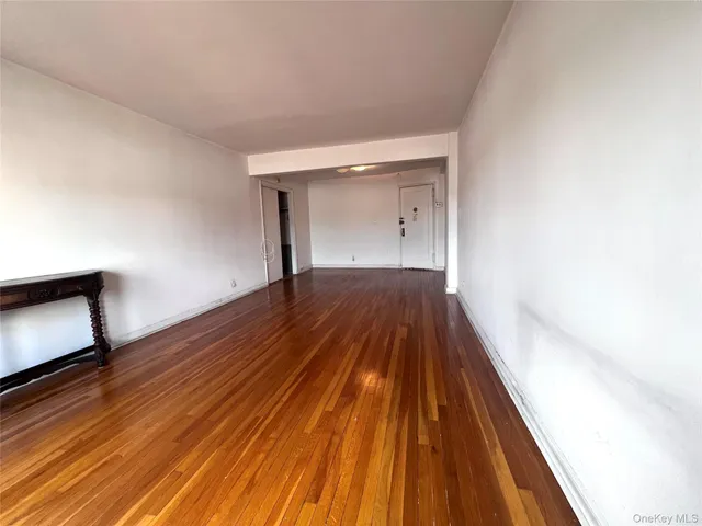 a view of wooden floor in an empty room
