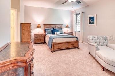 824 Ebb Tide Lane Kissimmee, FL 34759 - Photo 12 of 60 a spacious bedroom with a bed and a couch