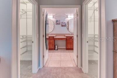 824 Ebb Tide Lane Kissimmee, FL 34759 - Photo 16 of 60 a view of a bathroom from a hallway