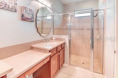 824 Ebb Tide Lane Kissimmee, FL 34759 - Photo 17 of 60 a bathroom with a sink vanity and a mirror