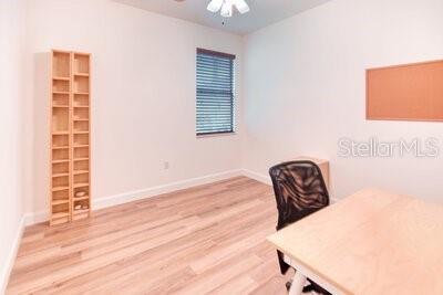 824 Ebb Tide Lane Kissimmee, FL 34759 - Photo 19 of 60 a view of a workspace with furniture and wooden floor