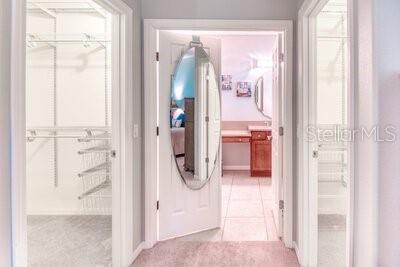 824 Ebb Tide Lane Kissimmee, FL 34759 - Photo 21 of 60 a bathroom with a glass shower door