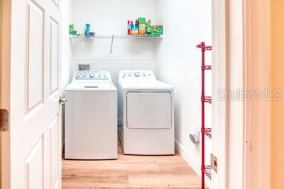 824 Ebb Tide Lane Kissimmee, FL 34759 - Photo 33 of 60 a utility room with dryer and washer