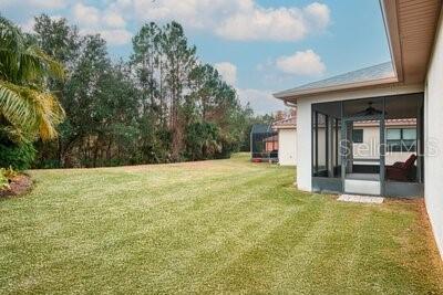 824 Ebb Tide Lane Kissimmee, FL 34759 - Photo 34 of 60 a view of an outdoor space and a yard