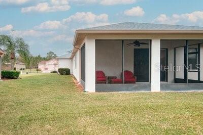 824 Ebb Tide Lane Kissimmee, FL 34759 - Photo 38 of 60 a view of a house with a backyard