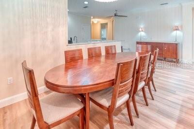 824 Ebb Tide Lane Kissimmee, FL 34759 - Photo 7 of 60 a dining room with furniture and wooden floor