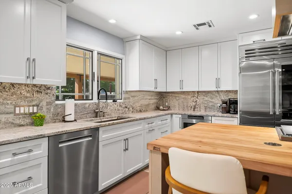 a kitchen with a sink and a window