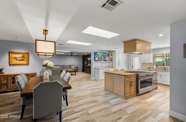 a bedroom with a large bed and a large window