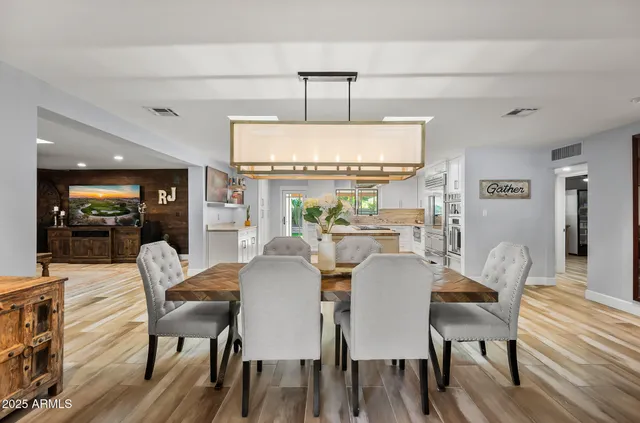 a bathroom with a granite countertop sink a mirror and a shower