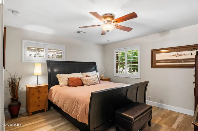 a view of a electric appliances in kitchen and empty room with wooden floor