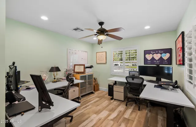 a view of a back yard with a table and a chairs