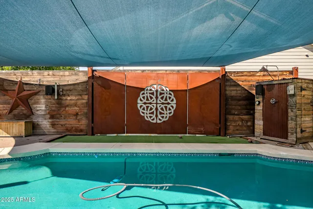 a front view of house with a garden