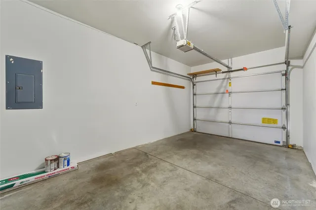 a view of a house with backyard and trees