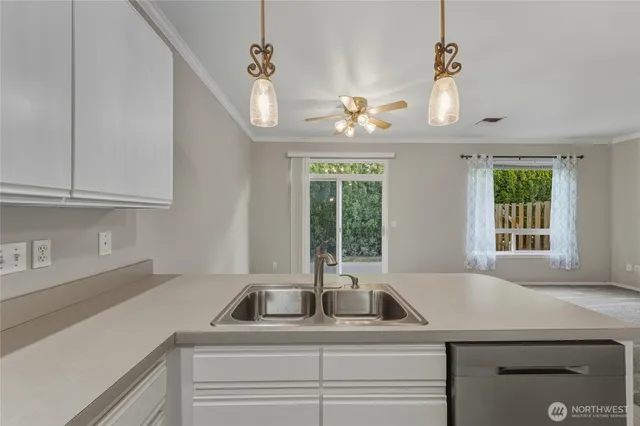a kitchen with a sink and a window