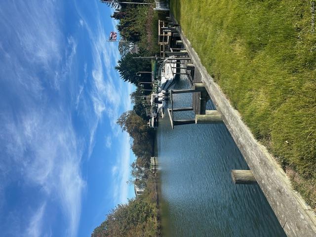 535 Bay Home Road Southold, NY 11971 - Photo 8 of 15 Dock area with a lawn and a water view