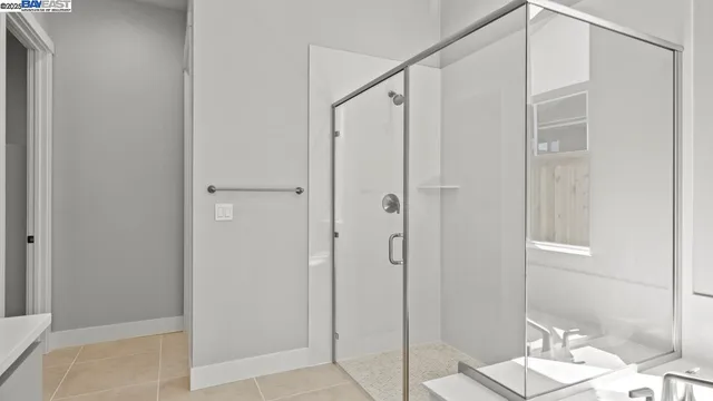 a bathroom with a shower and a sink