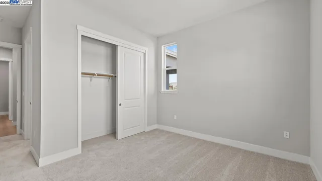 a bathroom with a sink toilet vanity and shower