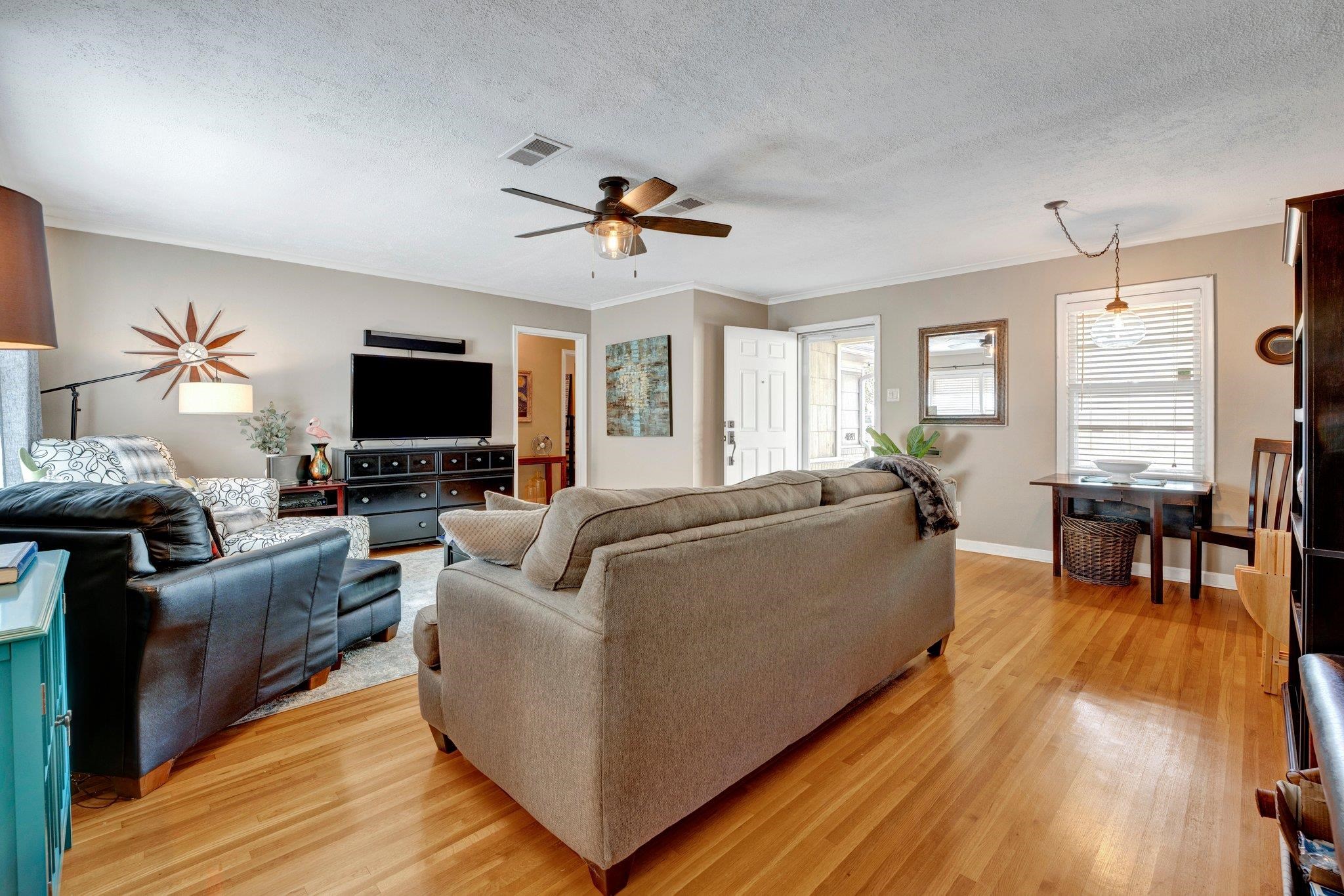 4891 Flamingo Road Memphis, TN 38117 - Photo 11 of 34 a living room with furniture and a flat screen tv