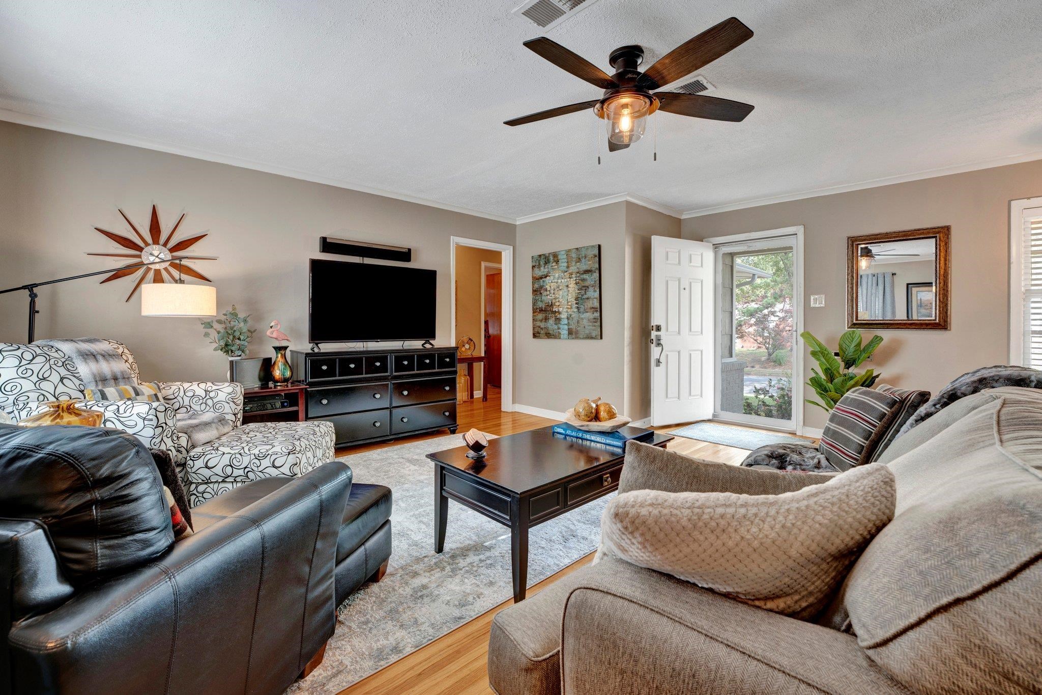 4891 Flamingo Road Memphis, TN 38117 - Photo 12 of 34 a living room with furniture and a flat screen tv