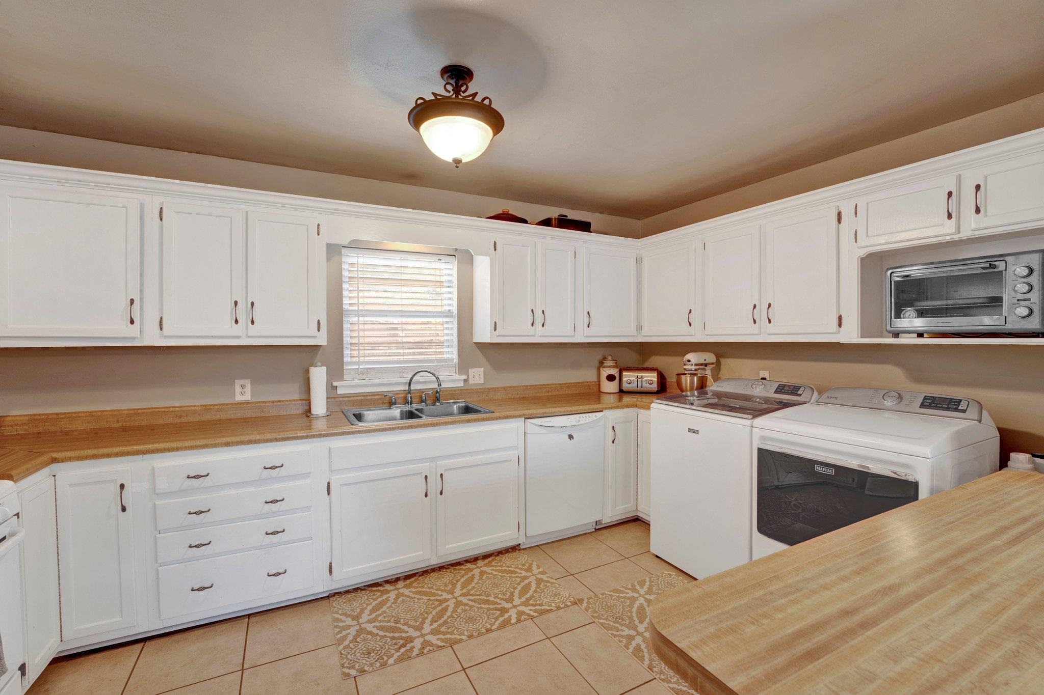 4891 Flamingo Road Memphis, TN 38117 - Photo 13 of 34 a kitchen with cabinets a sink and appliances