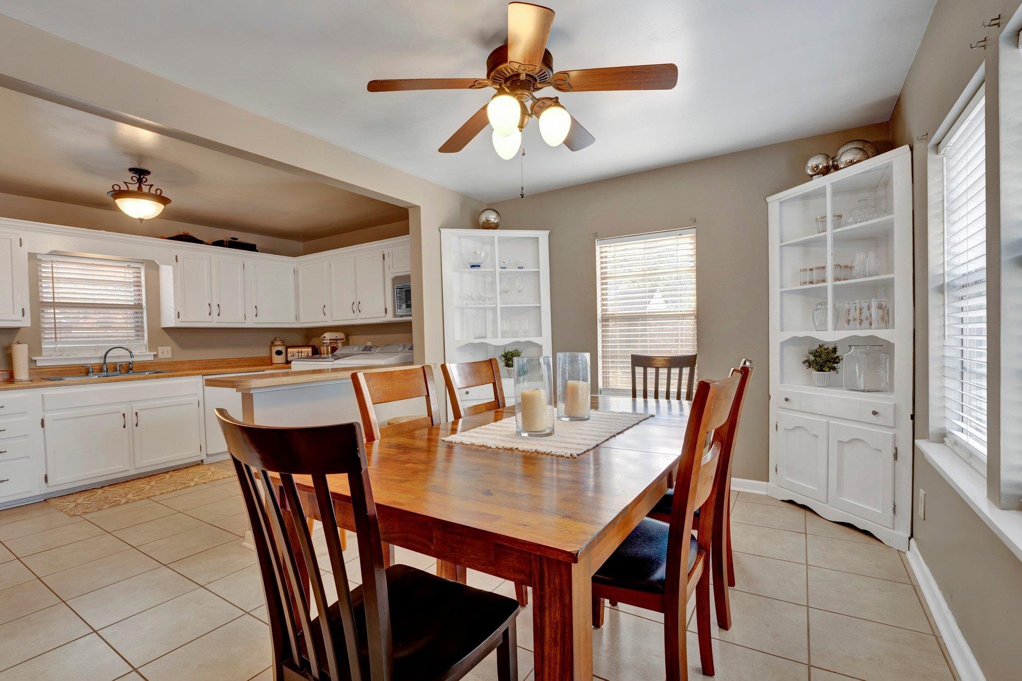 4891 Flamingo Road Memphis, TN 38117 - Photo 21 of 34 a view of a dining room with furniture and a chandelier